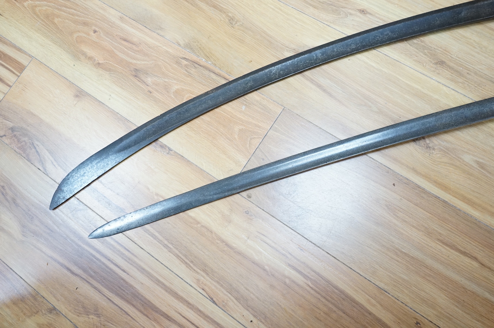 Two swords; a 1796 pattern cavalry troopers regulation pattern sword, the blade stamped W. Deakin, with government inspector’s mark, and regulation hilt, in fair condition, well worn with some light pitting, together wit
